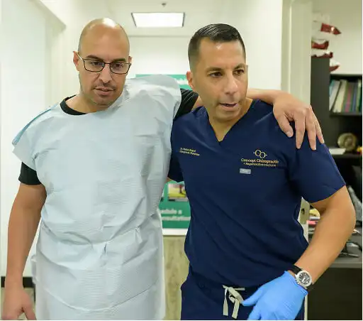 Chiropractor near me in Fairfax VA providing spinal adjustment at Concept Chiropractic clinic